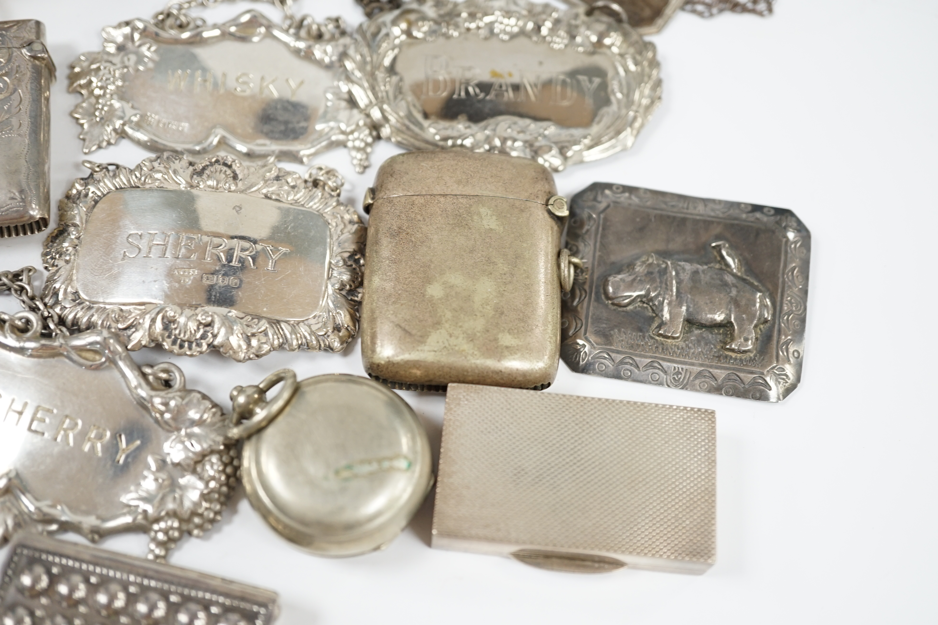 Sundry small silver and plated items including wine labels, vest cases, sovereign case and a Victorian silver snuff box, London, 1841, 79mm. Condition - poor to fair to good